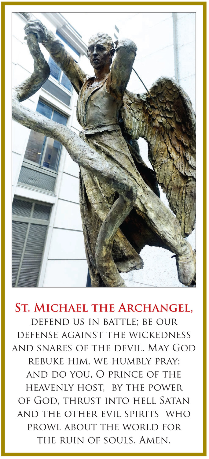 DEFENDER—A bronze sculpture of St. Michael the Archangel stands atop the steps outside St. Peter’s Church on Barclay Street in lower Manhattan.